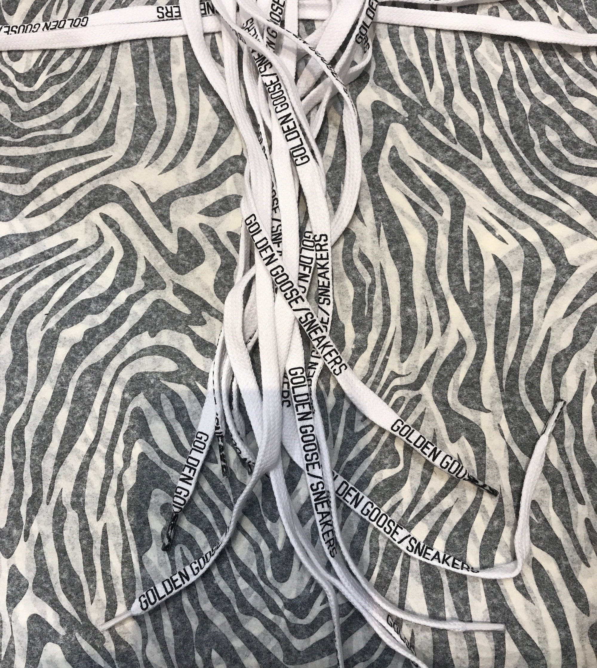 White cotton laces with black GG graphic print